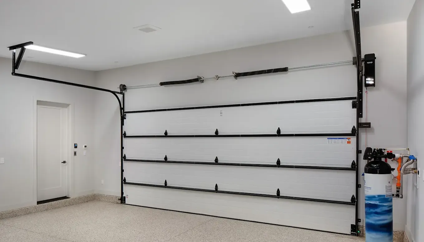 Garage door repair in a clean residential garage